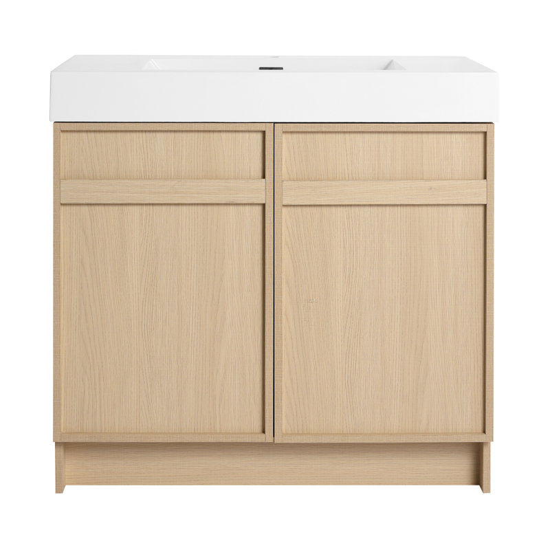 De meuble-lavabo autoportant avec lavabo en résine blanche et deux portes d'armoire à fermeture en douceur