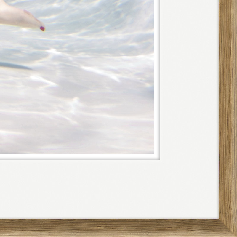 Caucasian Woman Swimming Underwater Framed