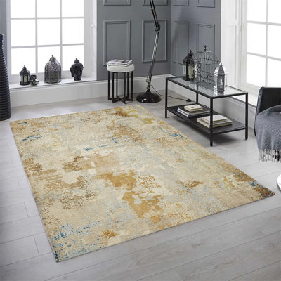 Tapis abstrait tissé à la machine en doré et beige