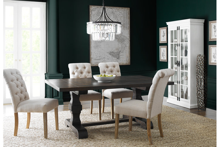 glam dining room with upholstered Parsons chairs