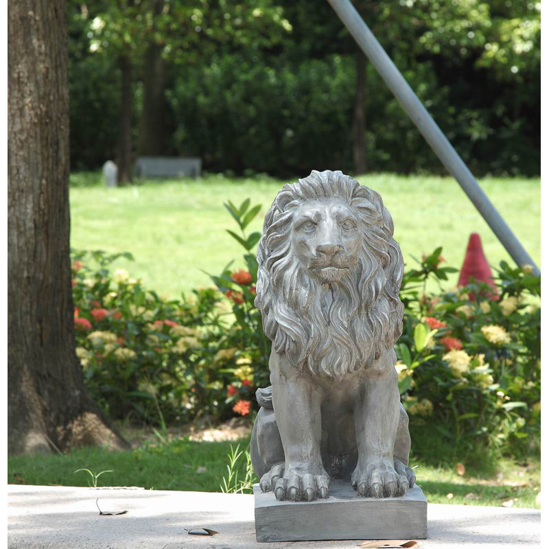 Statue de lion assis