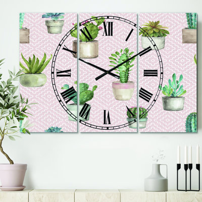 Cactus en pot sur un motif géométrique rose - horloge murale traditionnelle