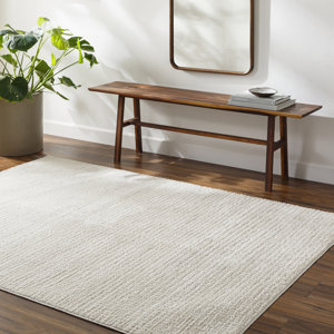 Arny Solid Color Machine Woven Polyester Area Rug in Cream