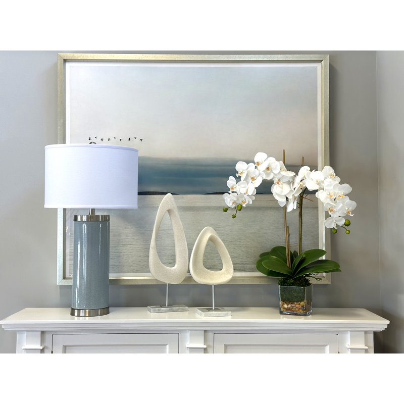 Orchid In A Square Glass Vase With Moss And Rocks