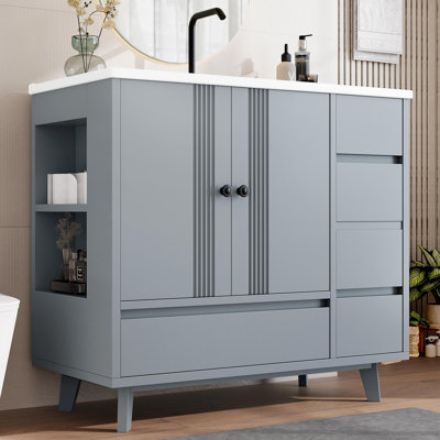 Meuble-lavabo en céramique à quatre tiroirs et deux portes