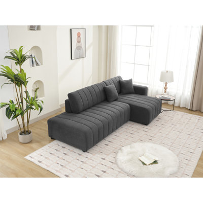 Coin en forme de L à 3 sièges avec design scandinave, laine gris foncé, rembourrage en mousse, sections modulaires, lignes épurées réversibles, palette de couleurs neutres, esthétique des boutons, revêtement en laine, rembourré,