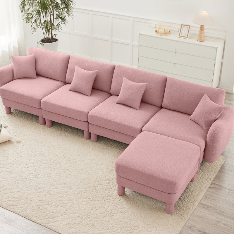 Tissu convertible en L rose à 4 places avec pieds en forme de coquillage, amovibles et cylindriques. Conception de conception moderne pour le confort de votre salon dans la chambre à coucher