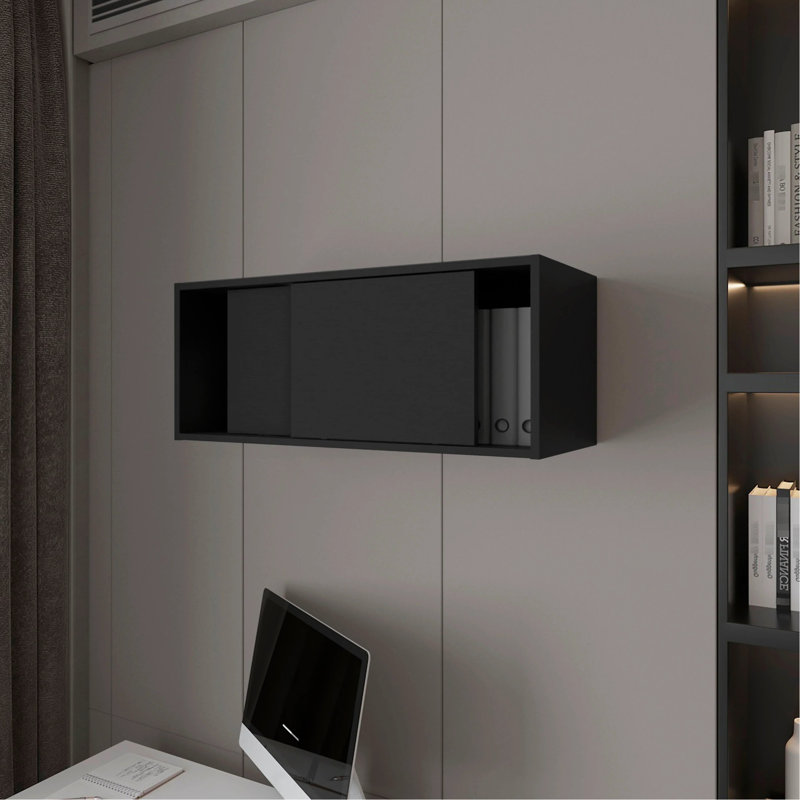 L'armoire flottante noire avec porte coulissante améliore le rangement des objets décoratifs, ce qui permet de maximiser l'espace d'étude