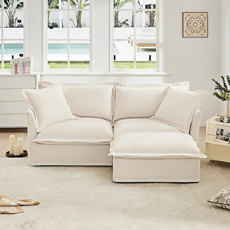 Canapé en tissu avec repose-pieds convertible