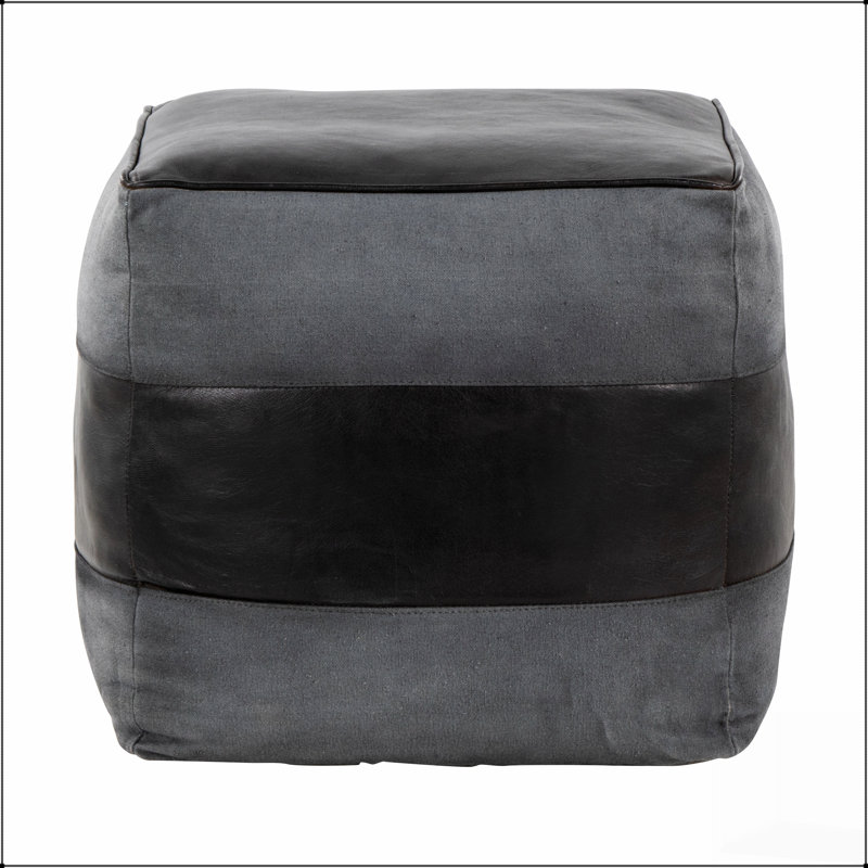 Élégant repose-pieds carré en cuir et toile, parfait pour les sièges supplémentaires et les repose-pieds dans les décors modernes.