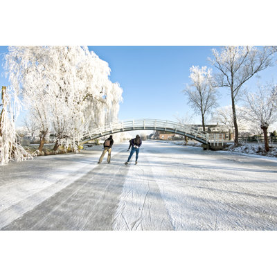 Ice Skating On A Frozen Canal In The Netherlands - Wrapped Canvas Print
