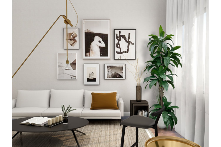 modern white living room with sheer curtains and a large green houseplant next to the couch