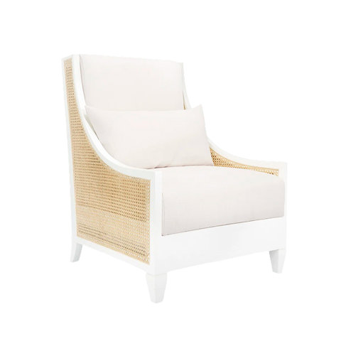 White linen armchair with cane sides.