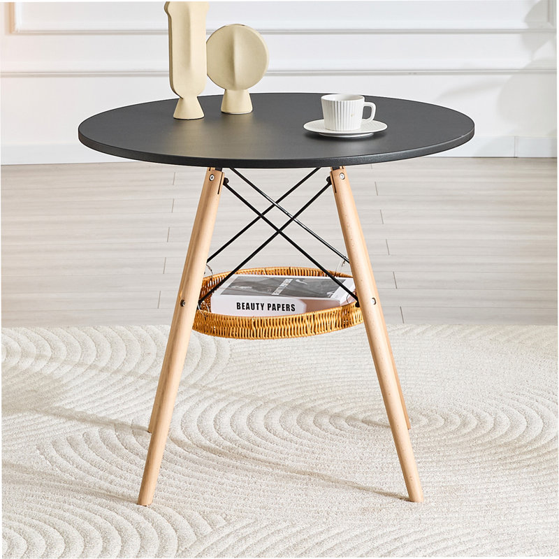 Table de salle à manger circulaire de 31,5 pouces de diamètre, plateau en panneau de fibres à densité moyenne noir, pieds en bois massif, avec structure de panier de rangement suspendue. Une table basse décontractée pouvant accueillir de 2 à 4 personnes.