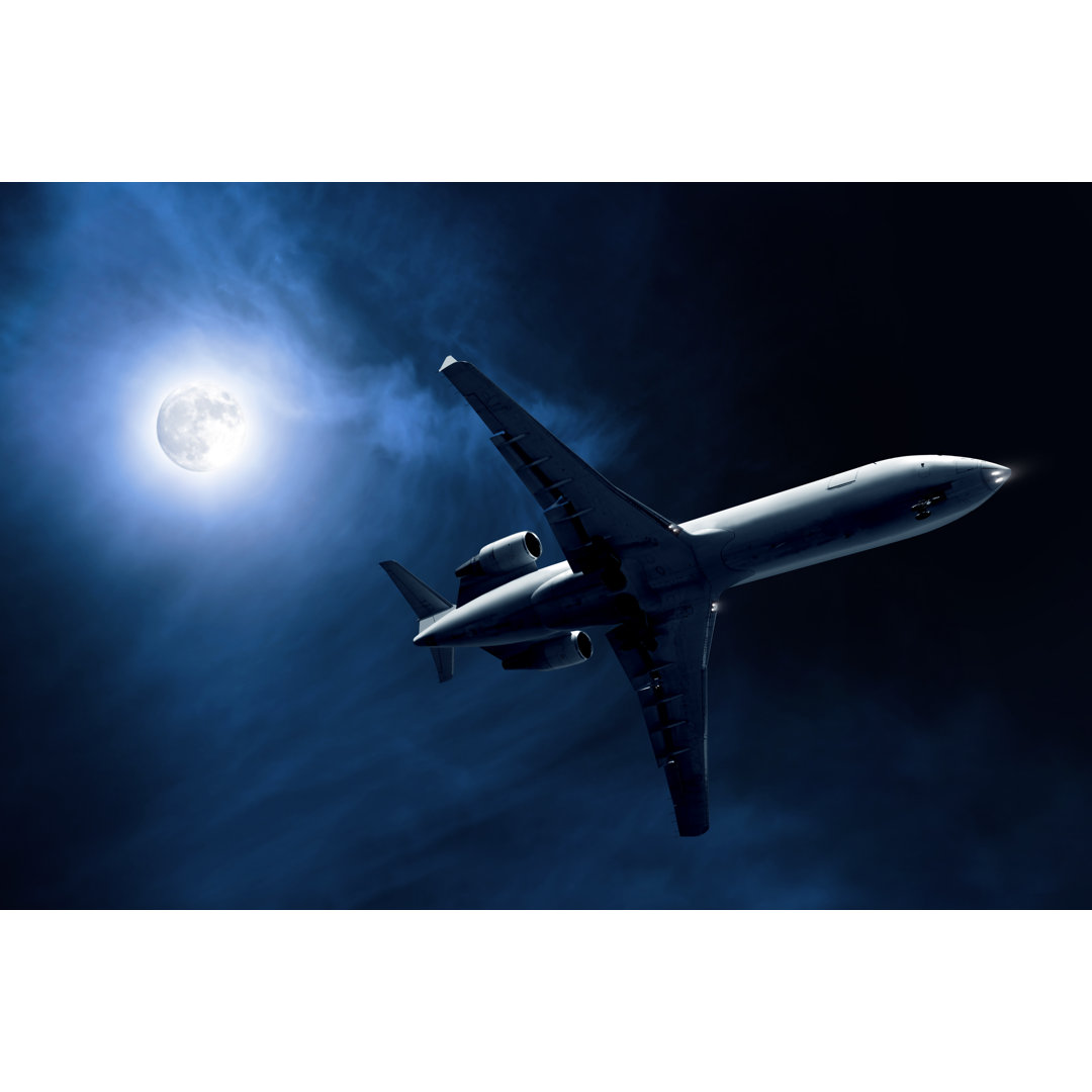 Corporate Jet Airplane Landing At Night von Sharplydone - Leinwandbild