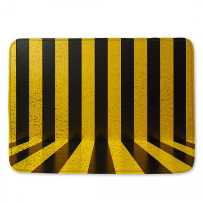 Tapis de bain jaune à rayures noires