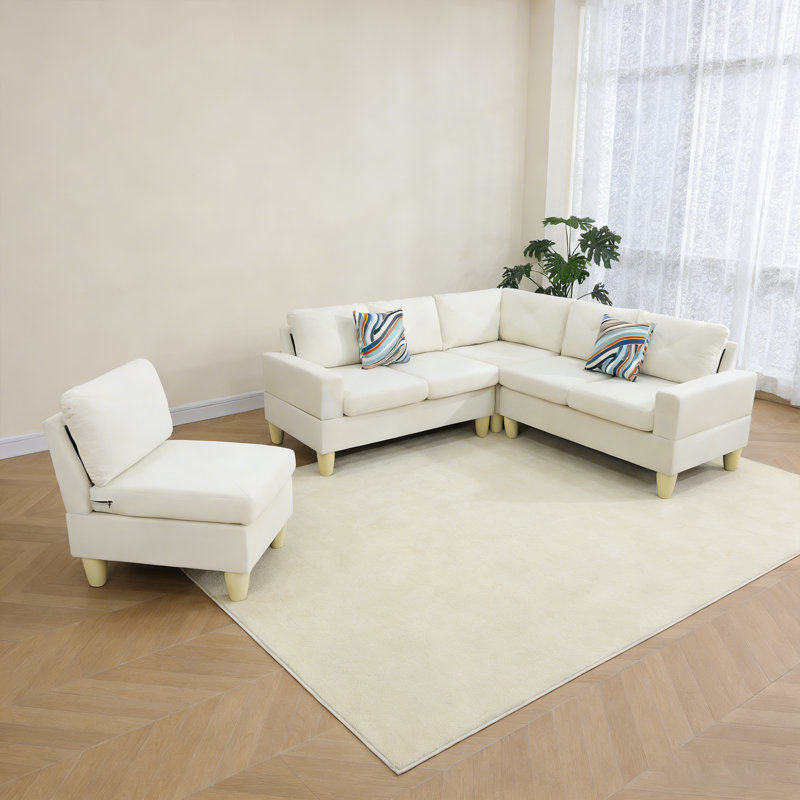Cet ensemble de quatre pièces de canapé en tissu beige peut être librement combiné avec un cadre double en bois massif à ressorts