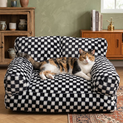 Canapé pour animal de compagnie en imitation fourrure pour chats et chiens, mini lit de détente pour animal de compagnie, mobilier contemporain pour animaux de compagnie, housse de coussin amovible et lavable, convient aux chats et aux petits et moyens chiens, taille moyenne 24 po x 19 po, disponible en noir et blanc