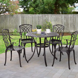 Tesha 4 - Person Patio Dining Set with Round Table