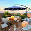 Parasol de terrasse 10 pi avec parasol solaire à DEL 8 lumières avec manivelle et base transversale-488566664