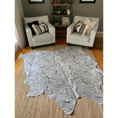 Newspaper Print Cowhide Rug