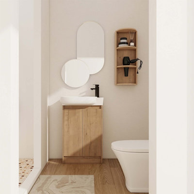 Meuble-lavabo compact avec lavabo intégré et support de rangement spacieux, parfait pour les petites salles de bain et les décors modernes.