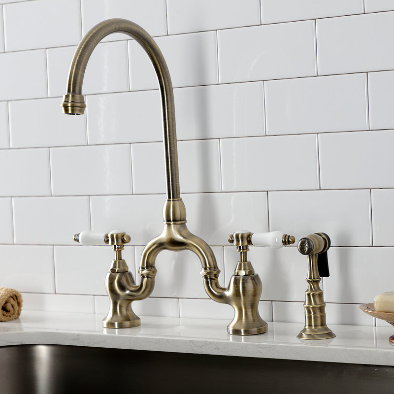 Kingston Brass Bel-Air Two-Handle 3-Hole Deck Mount Bridge Kitchen Faucet with Brass Side Sprayer, Antique Brass