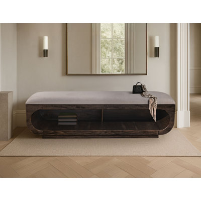 Banc en bois noir Balam avec siège rembourré et rangement ouvert en dessous.