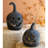 SET OF TWO BLACK CLAY JACK-O-LANTERNS