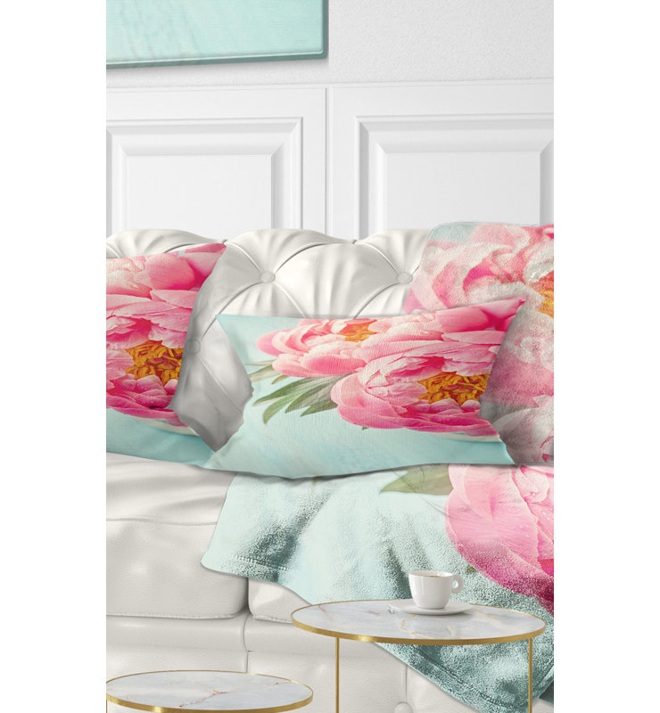 Coussin lombaire floral sur fond pivoine