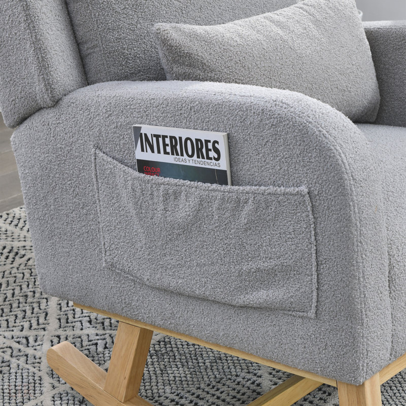 Fauteuil à bascule de salon moderne à dossier haut avec un coussin lombaire et deux poches latérales