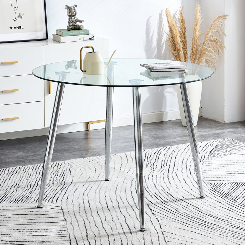Un plateau de table en verre d'un diamètre de 38,6 pouces et une table de salle à manger circulaire minimaliste moderne avec des pieds en métal argenté. Convient pour les salons et les salles de conférence.
