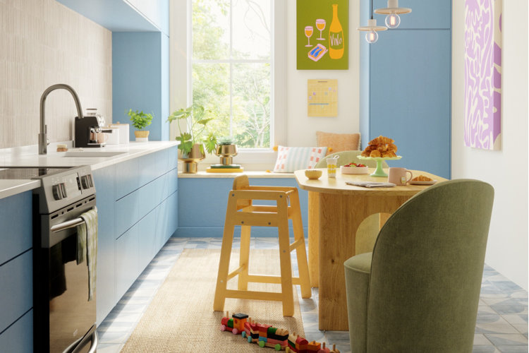 blue galley kitchen with window bench, oval dining table, and green upholstered chairs