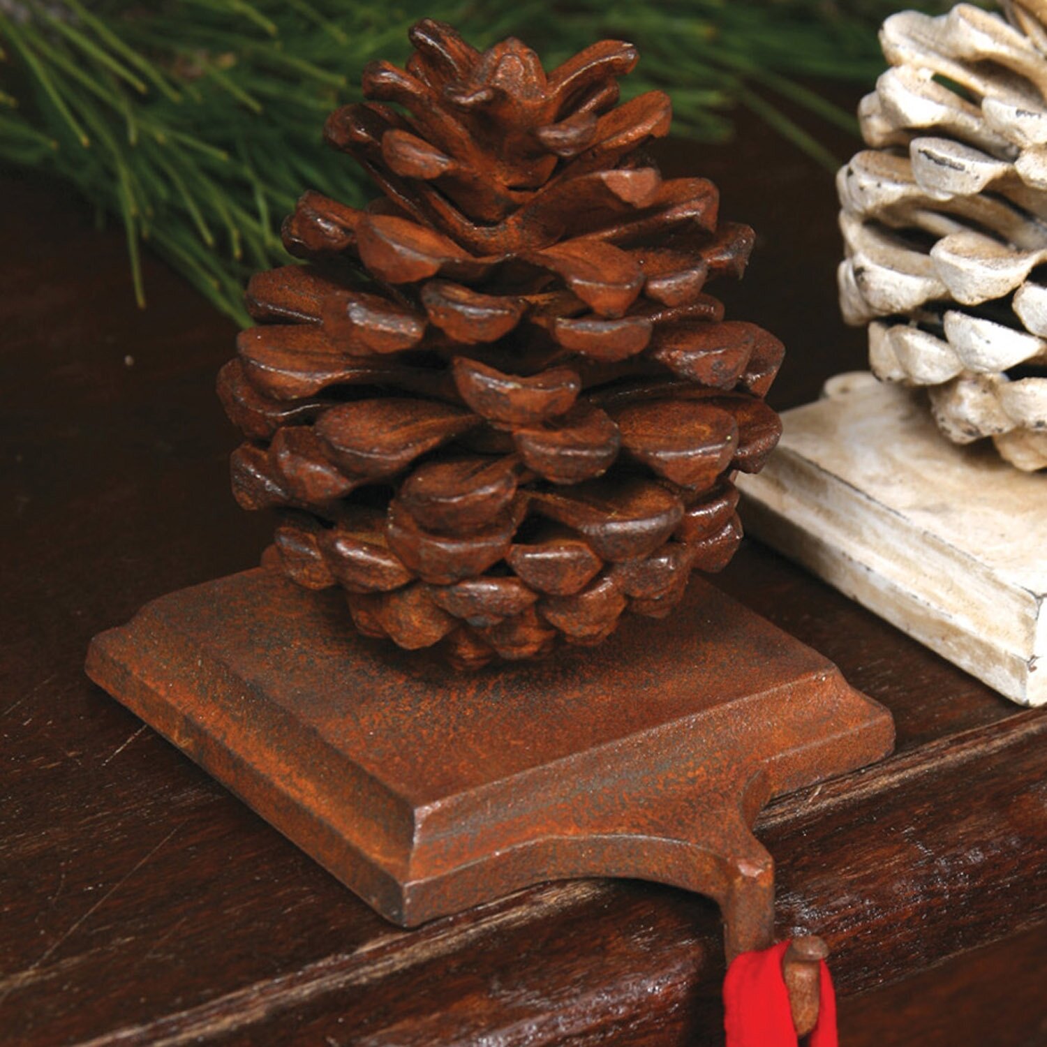 https://assets.wfcdn.com/im/86474215/compr-r85/5653/56531461/pinecone-stocking-holder.jpg