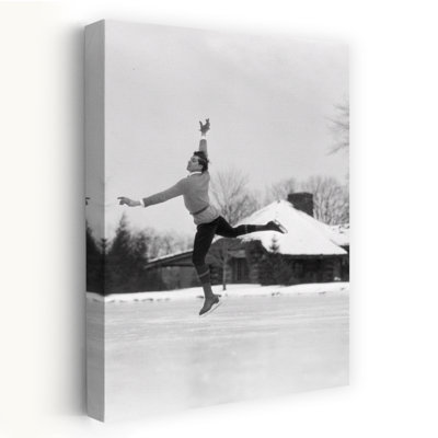 1920s 1930s MAN ICE SKATING ON OUTDOOR ICE RINK DOING AN ARABESQUE JUMPING by H. Armstrong Roberts - Wrapped Canvas Print