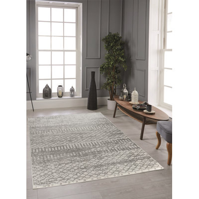 Tapis géométrique crème