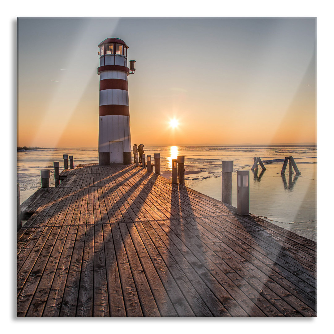 Glasbild Leuchtturm bei Sonnenuntergang