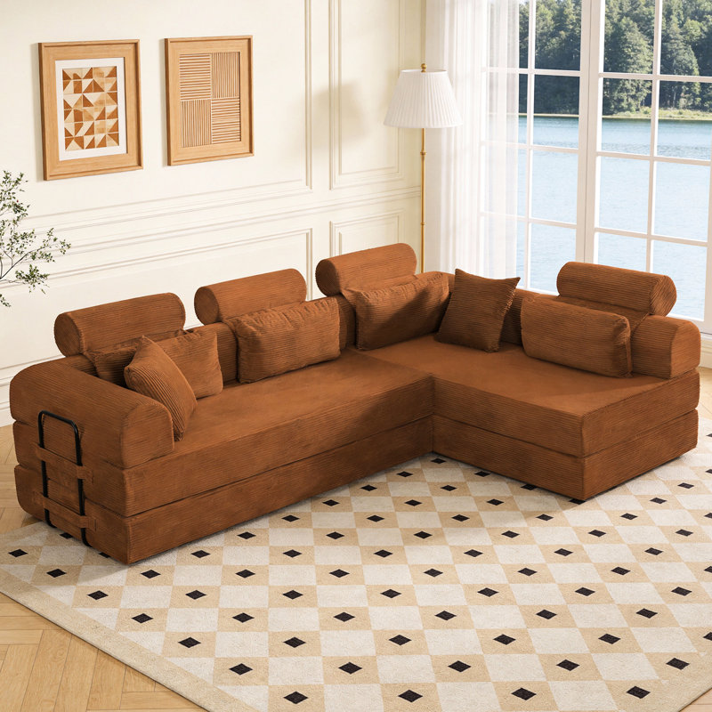Canapé d'angle en velours côtelé orange 4 places, convertible en lit pour un confort optimal dans votre salon ou votre cinéma maison, design compact et peu encombrant.