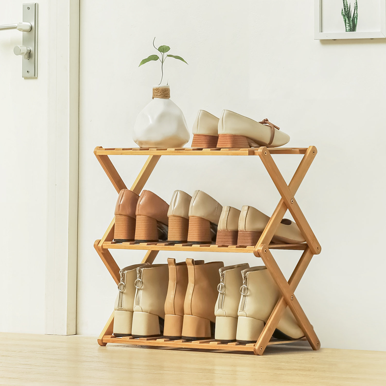 https://assets.wfcdn.com/im/86509582/compr-r85/2021/202123077/3-tiers-9-pairs-folding-shoe-rack-installation-free-bamboo-organizer-storage-shoes-shelf-for-home.jpg