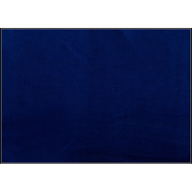 Luxueux fauteuil inclinable en velours bleu avec dossier capitonné carré et accoudoirs à plateau-coussin pour un confort ultime