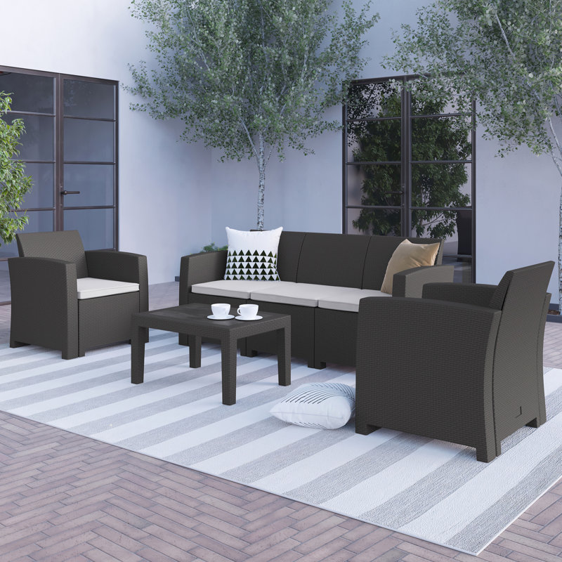 Ensemble de 4 chaises d'extérieur en faux rotin Alderman, canapé et table