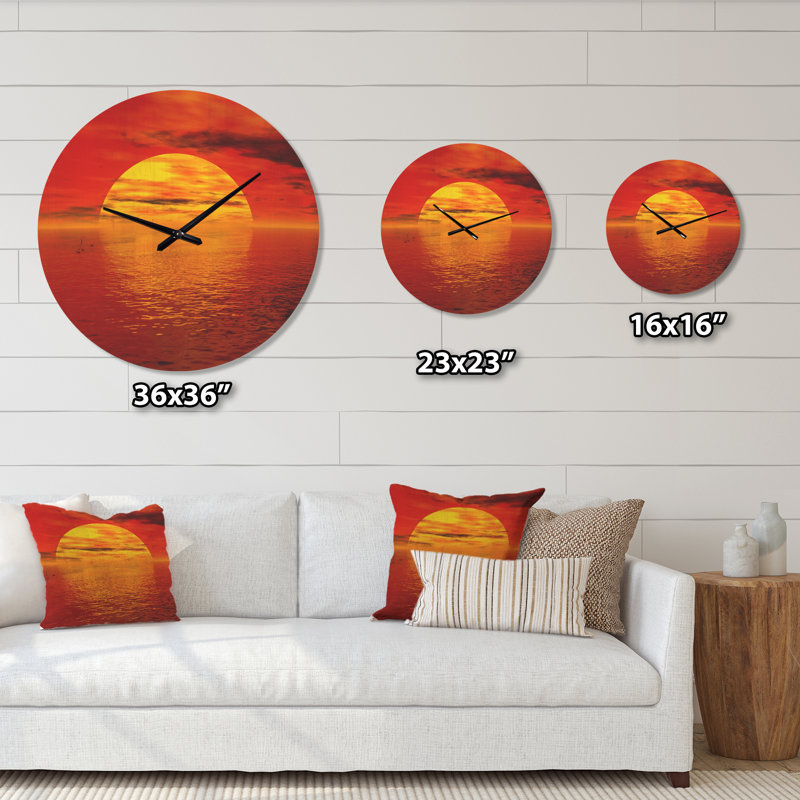 Horloge murale soleil tombant sur l'océan, Moyenne