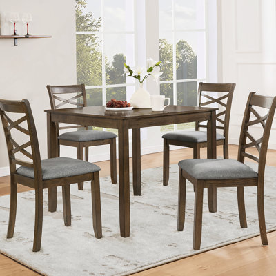 Ensemble de quatre chaises de salle à manger en bois avec sièges rembourrés, idéal pour la salle à manger, le salon et la cuisine, alliant confort et style