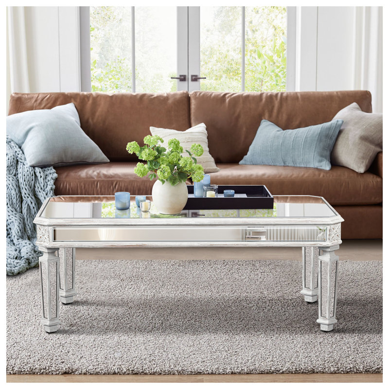 Table basse à miroir argenté avec pieds sculptés rétro, centre de table rectangulaire en verre pour un décor de salon moderne