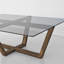 Table basse en verre trempé avec base géométrique en bois massif