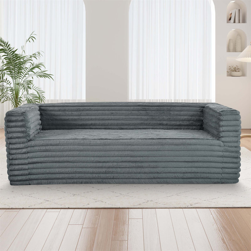 Canapé moelleux moderne à trois places en velours côtelé avec accoudoirs carrés, offrant un confort luxueux pour votre espace de vie