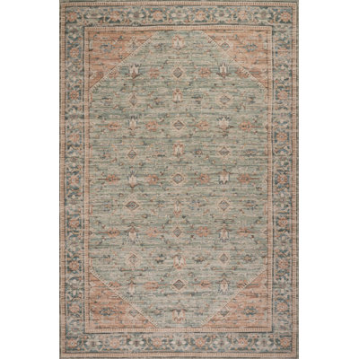 Nysera Traditional Bordered Area Rug