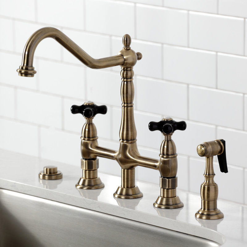 Kingston Brass Duchess Two-Handle 4-Hole Deck Mount Bridge Kitchen Faucet with Brass Side Sprayer, Antique Brass