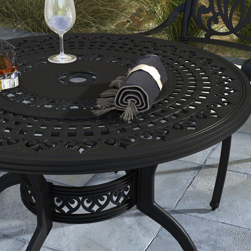Deneise 4 - Person Patio Dining Set with Round Table , Cushions Included