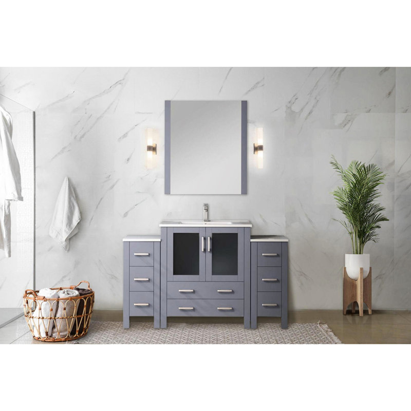 Meuble-lavabo simple 54 po De couleur grise foncée, avec des unités de rangement latérales, un comptoir en céramique blanc, un miroir mural de 28 po, un système de tiroir à fermeture en douceur, une structure à base de bois et du contreplaqué